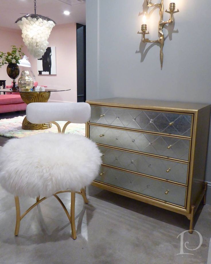 mirrored chest and fur stool